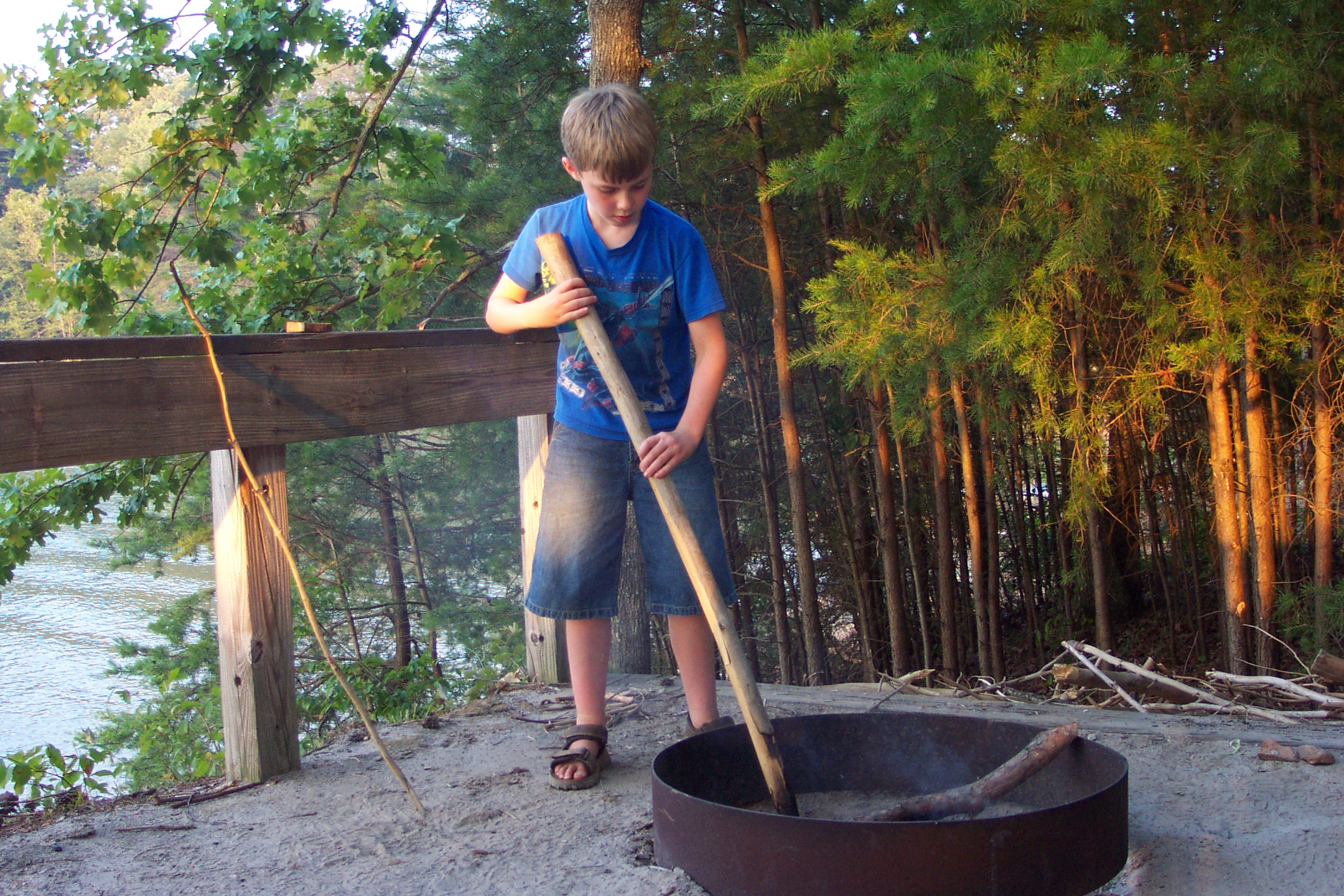 Caleb stirring fire